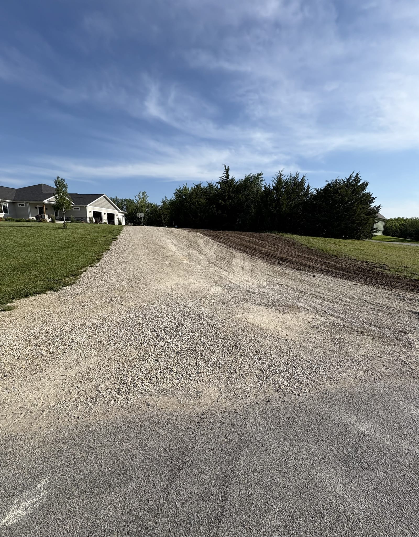 Newly installed driveway after excavation and grading