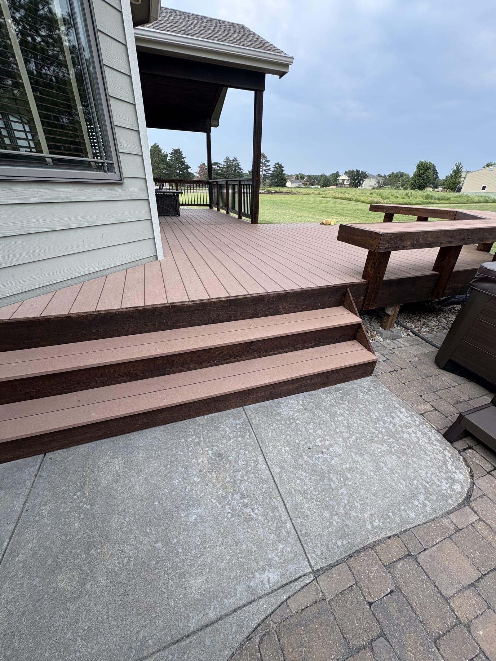 Deck staining in progress, view one