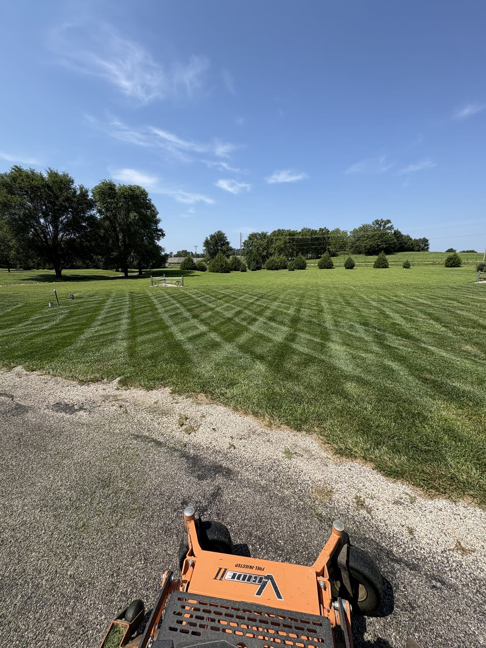 Freshly mowed residential lawn in Manhattan, KS with clean mower stripes