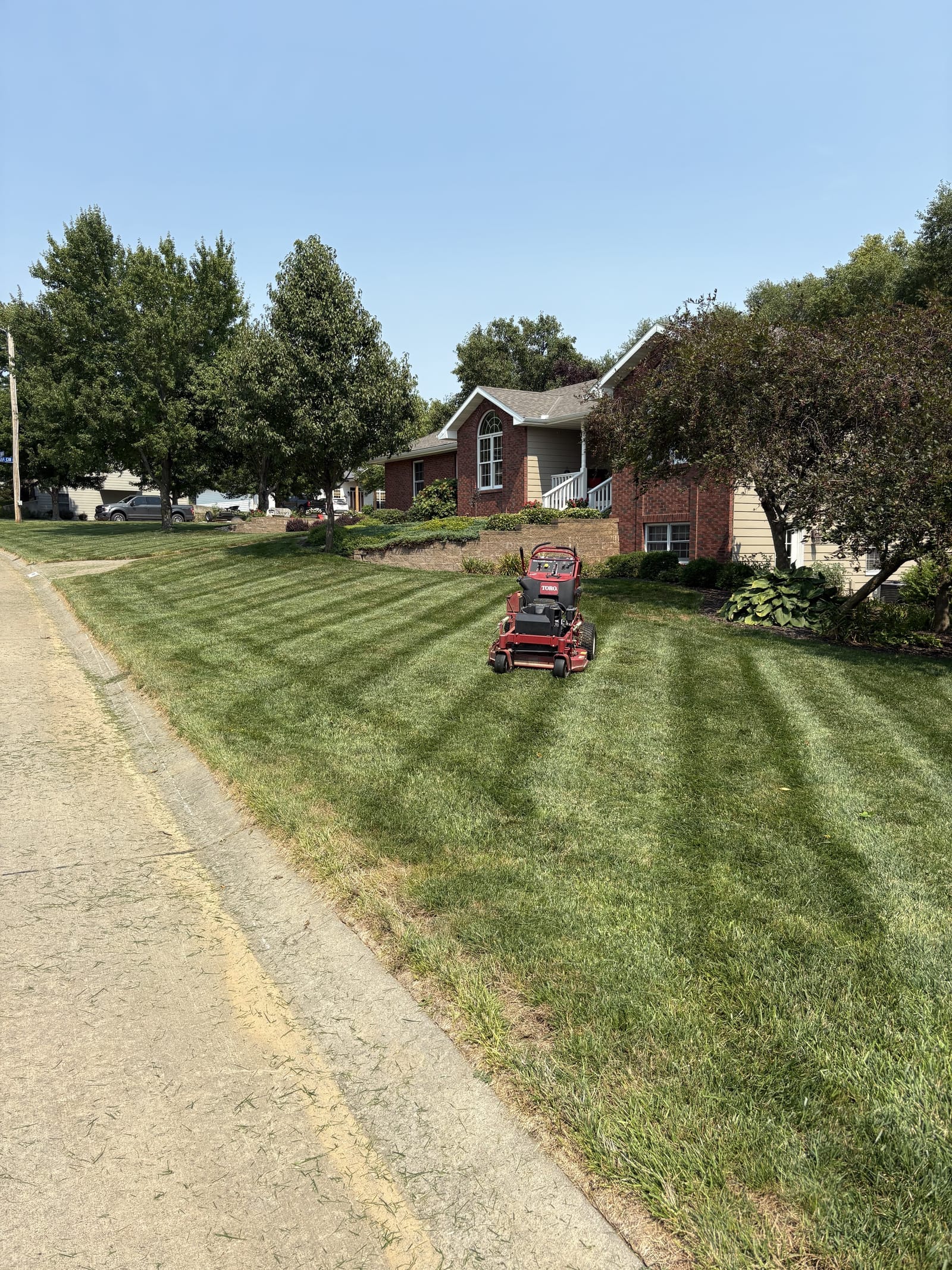 Thick, healthy green lawn with fresh mower stripes in Manhattan, KS