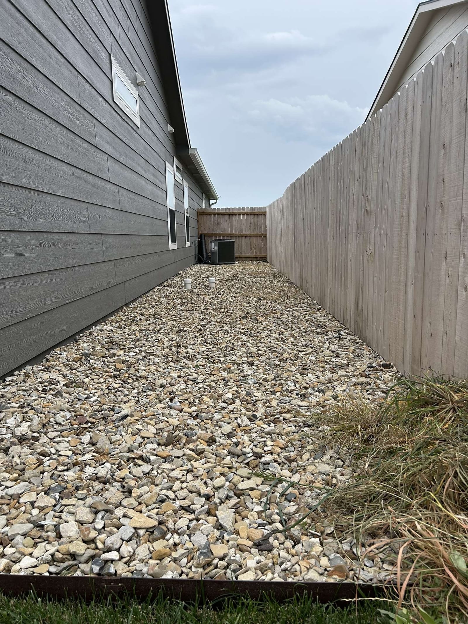 Gravel side yard after a weed treatment application